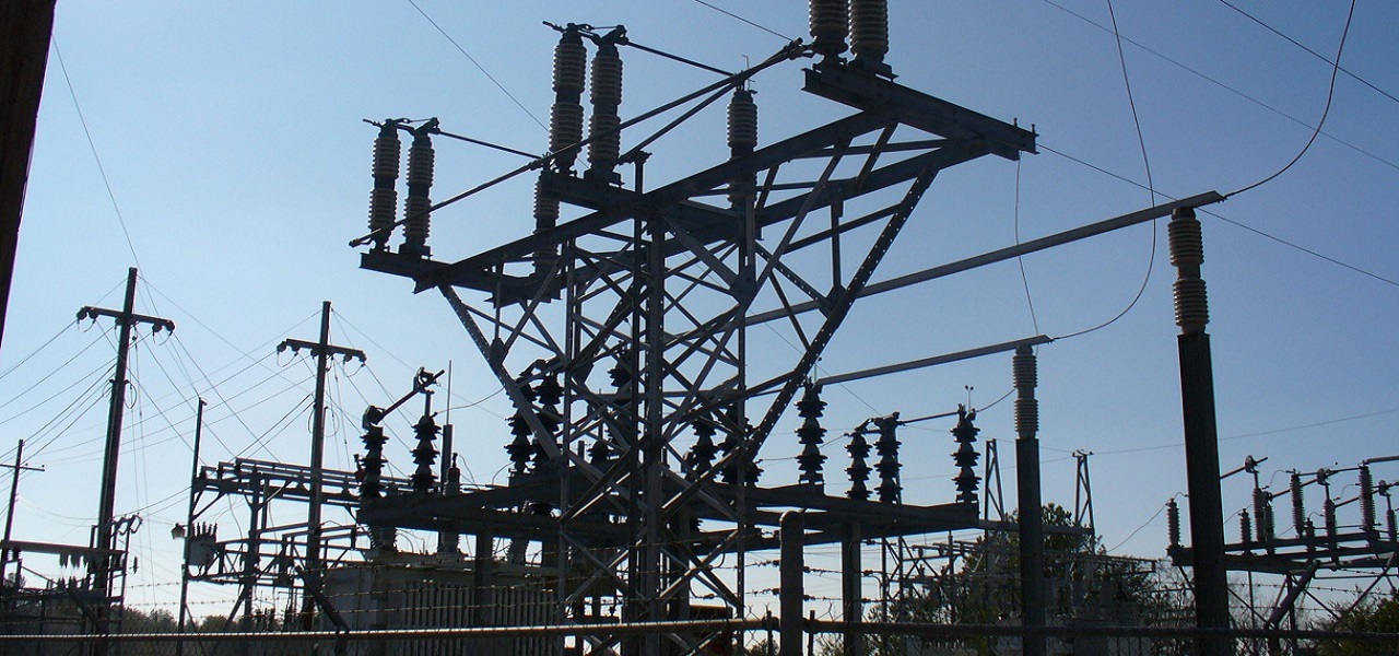 Electrical power substation structure against a blue sky
